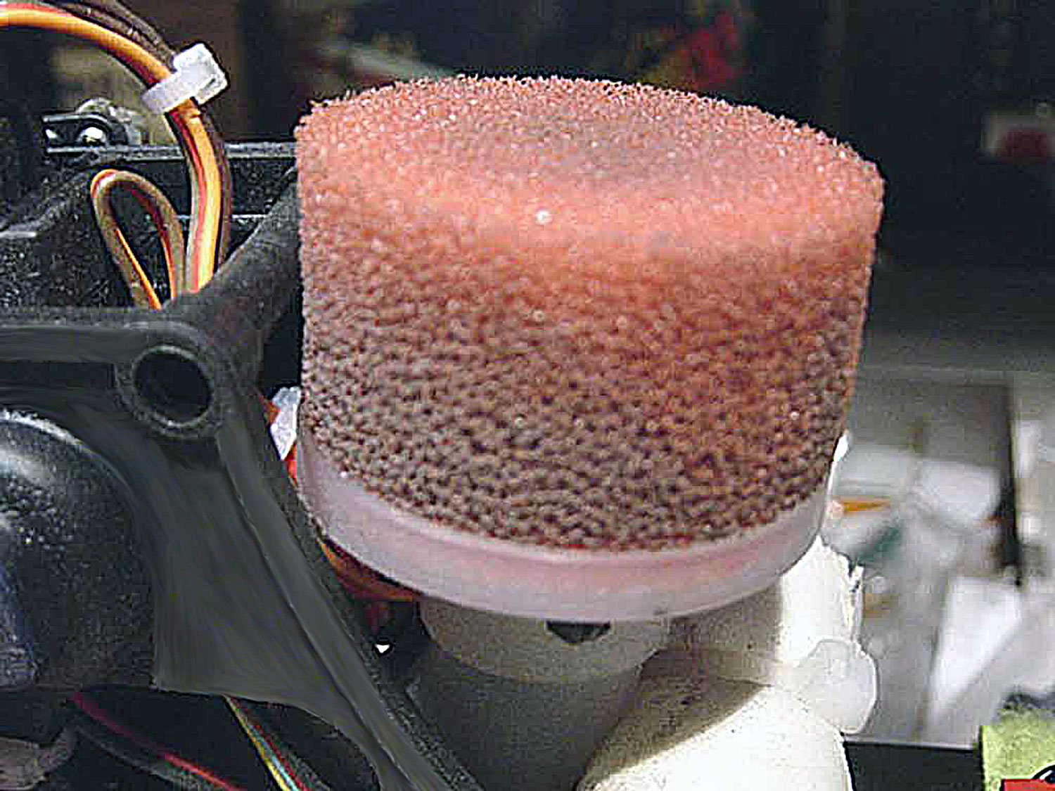 Close up of a dirty foam air filter element fitetd to a Pantera P6 model helicopter